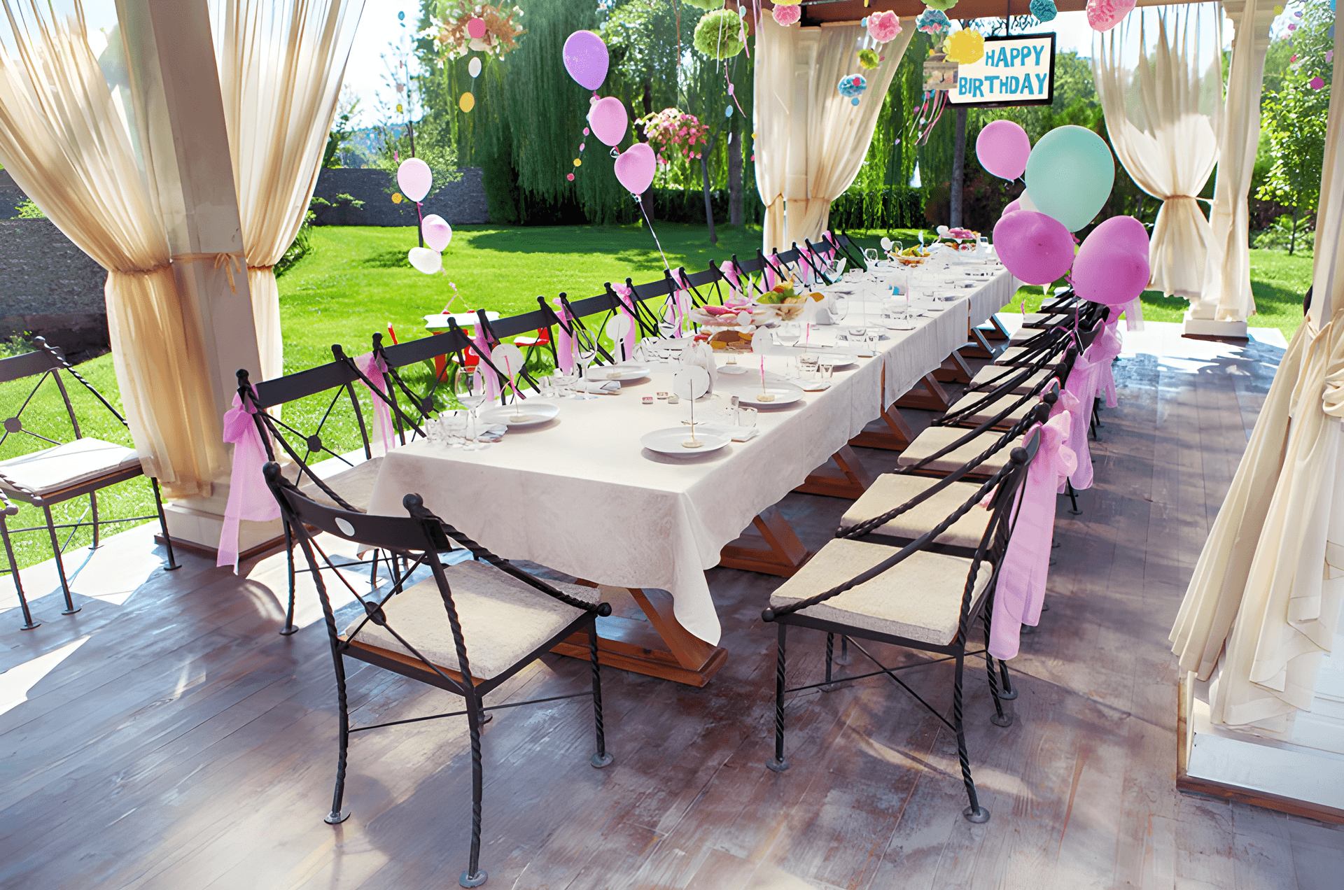 Long table set for a garden birthday party — the kind of small event our sound systems cover