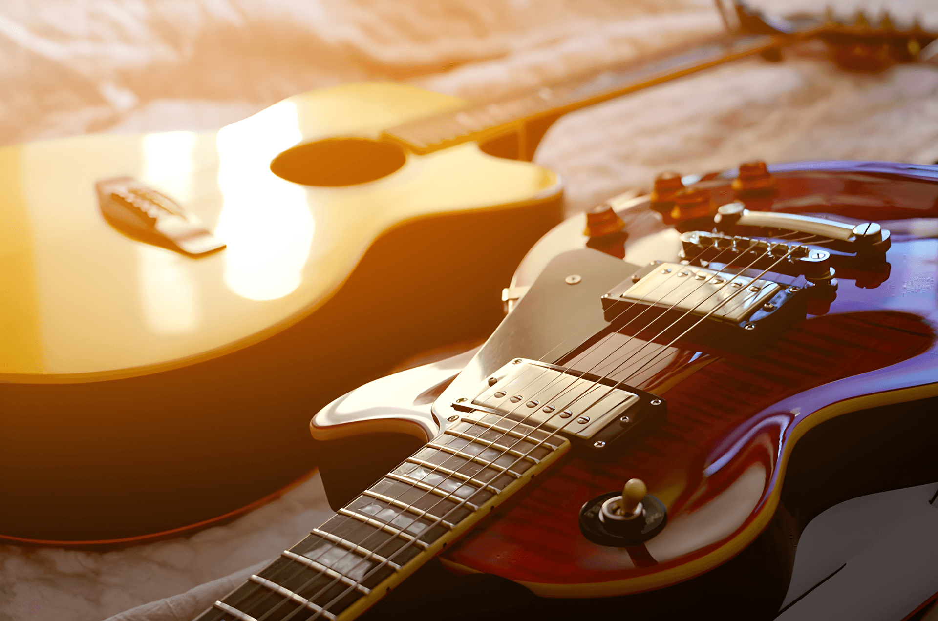 Acoustic guitar and electric guitar side by side — guitar rental in Singapore