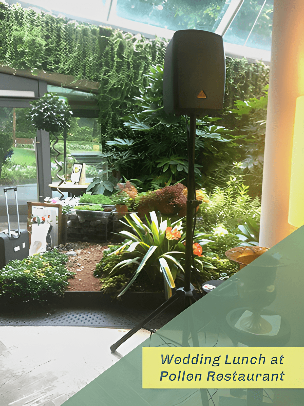 Speaker on a tripod stand among lush greenery at a wedding lunch, Pollen Restaurant, Singapore